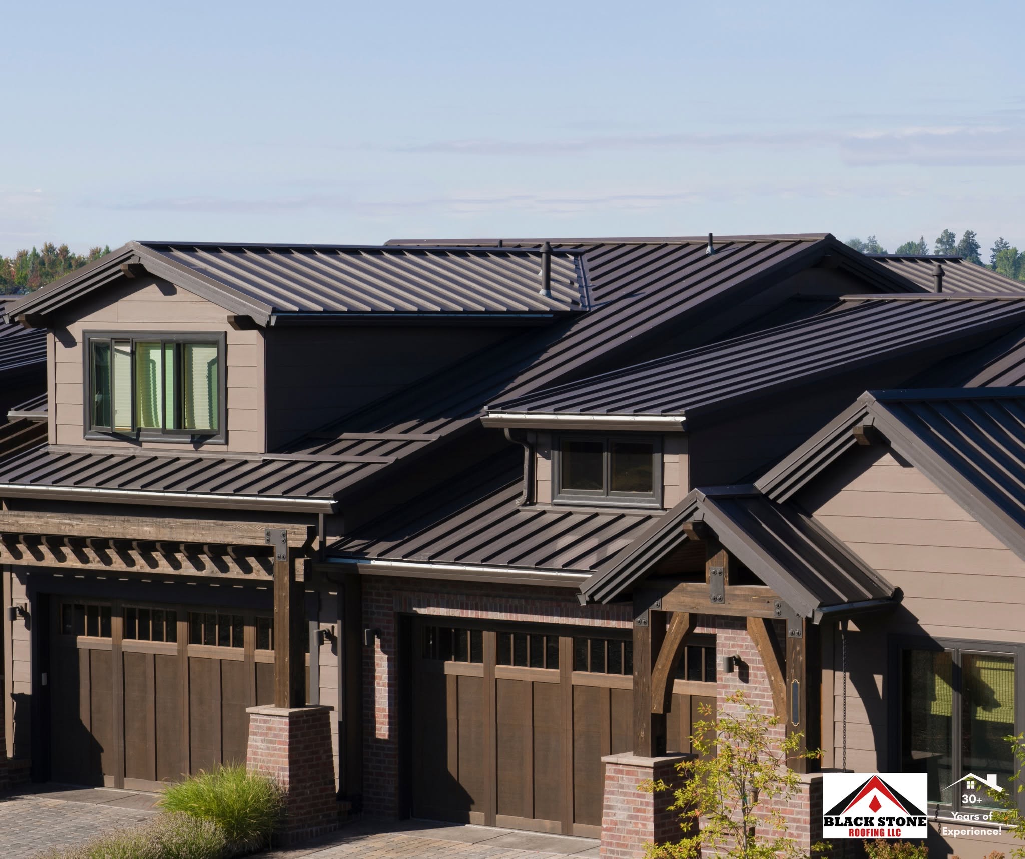 Dark bronze standing seam metal roof installed by Black Stone Roofing on a craftsman style home